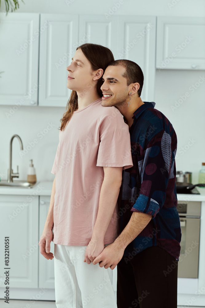 A gay couple in casual clothes standing in a cozy kitchen, sharing a tender embrace. A gay couple in casual clothes standing in a cozy kitchen, sharing a tender embrace.