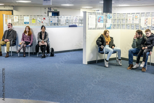 People waiting in a seating area of a medical practice in the UK photo
