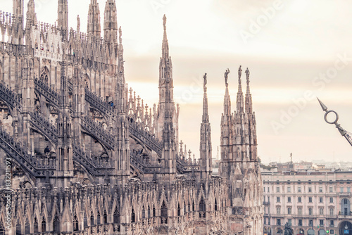 Gothic cathedral spires against a soft sky at dusk. photo