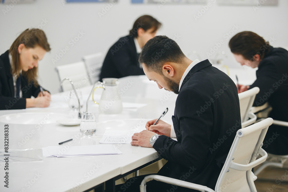 Fototapeta premium Blind tasting exam, young sommeliers degustation various alcohol drinks in wine school.