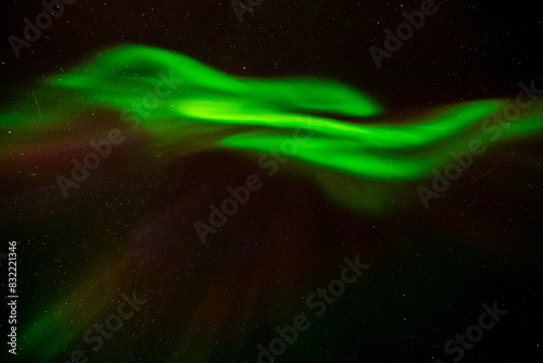 Polar lights, Aurora borealis in green over mountains, Norway