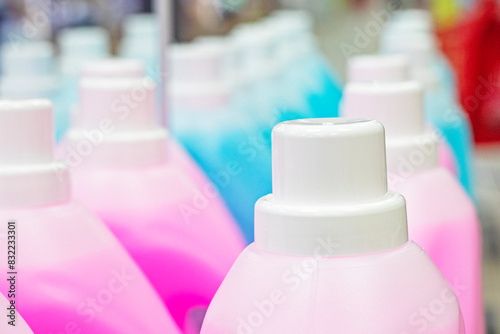 plastic containers with a chemical solution for cleaning, washing floors, cars and other household items in the supermarket photo