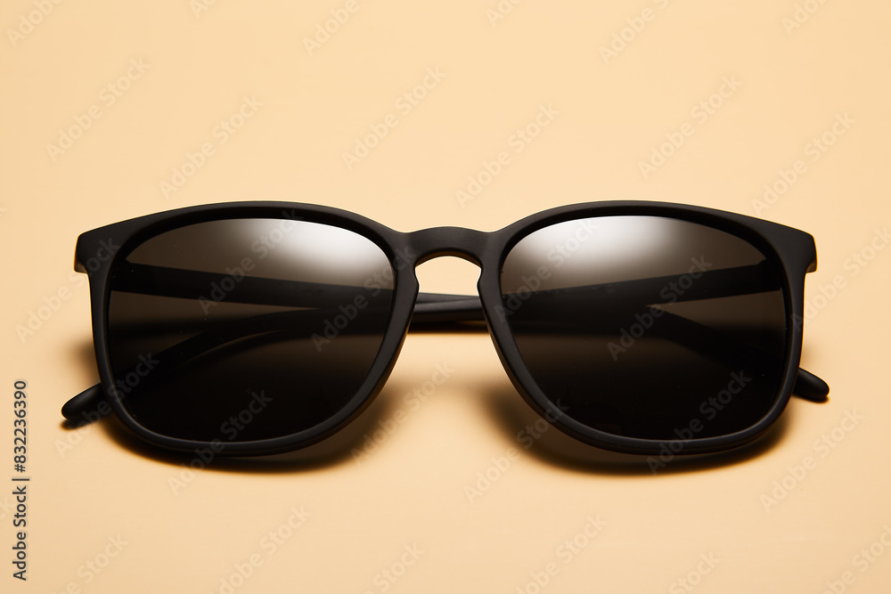 Sunglasses, sunnies isolated on beige sandy background. Sunglasses, sunnies isolated on beige sandy background.