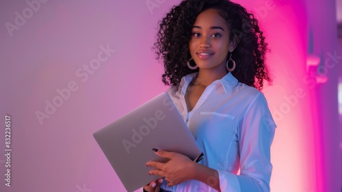 The woman holding laptop
