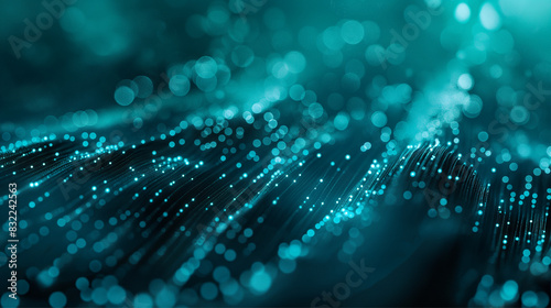 A digital abstract depiction of glowing turquoise fibers with bokeh effect, creating a sense of connectivity across the image