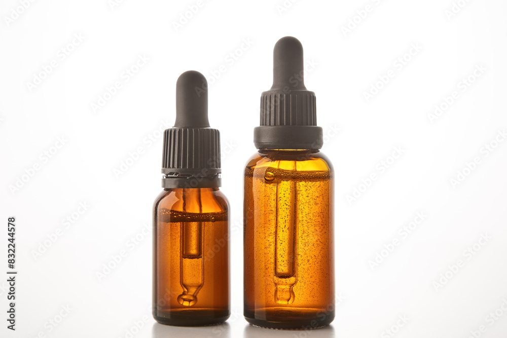 Glass containers of different sizes with pipettes. Glass containers of different sizes with pipettes.