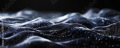 Abstract close-up of wavy dark fabric with reflective highlights, creating a surreal and mysterious texture. Perfect for background or design use. photo
