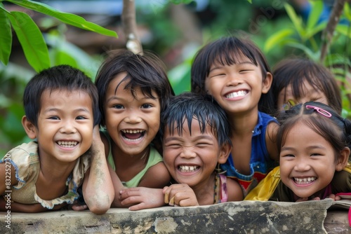 Group of asian children smiling at the camera with happy face. © Iigo