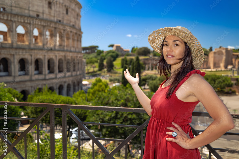 Fototapeta premium A smiling tourist visits the Colosseum in Rome, Italy.