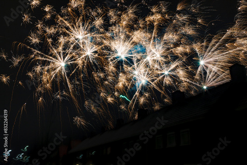 Fireworks light up the night sky creating a vibrant and festive atmosphere in Dutch town. photo