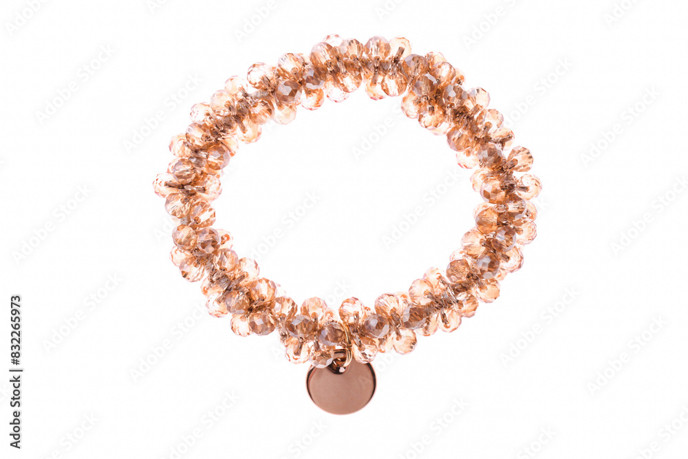 Obraz premium Hair elastic with golden beads and pendant