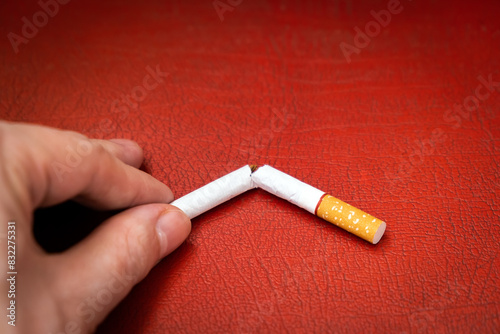 Broken Cigarette in the Hand Closeup © Sabphoto
