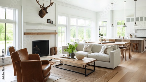 Photograph of an interior design magazine page featuring a simple, modern farmhouse living room with a leather armchair and wood coffee table near the fireplace. White walls, wooden floorboards, and