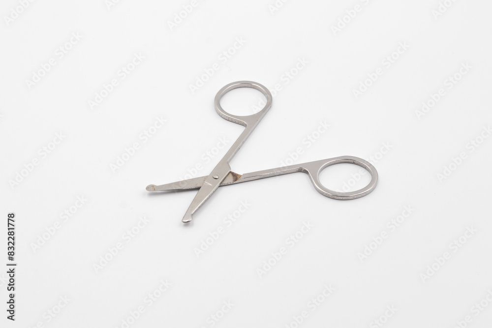 Silver metal scissors on a white background, Scissors for sewing on white background, Very sharp retro professional tailor scissors Silver metal scissors on a white background, Scissors for sewing on white background, Very sharp retro professional tailor scissors