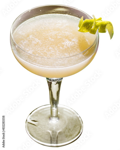 yellow tropical cocktail on a background of foliage, shadows from the sun. Green background