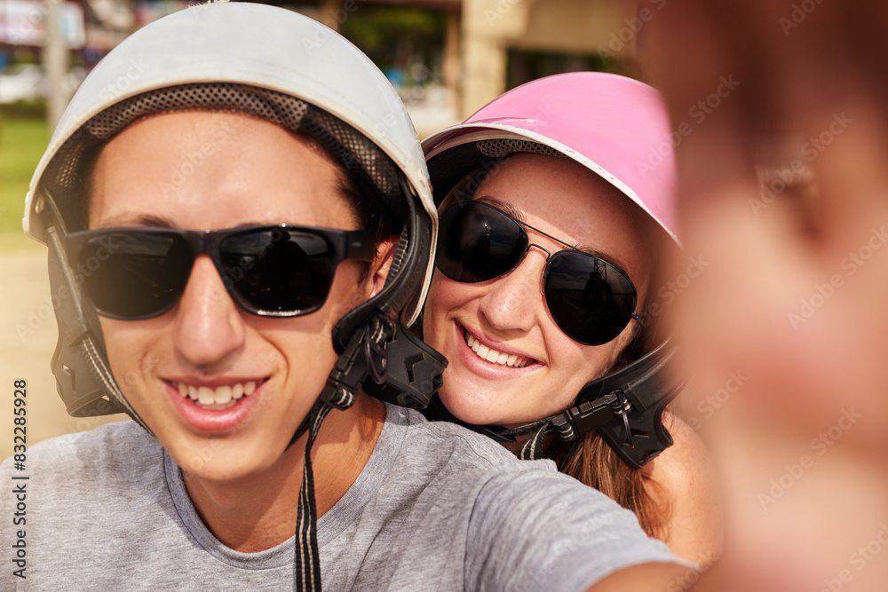 Selfie, helmet and portrait of couple on road trip, vacation and travel on summer holiday. Face, man and woman take picture with sunglasses for journey, photography and happy memory on social media Selfie, helmet and portrait of couple on road trip, vacation and travel on summer holiday. Face, man and woman take picture with sunglasses for journey, photography and happy memory on social media