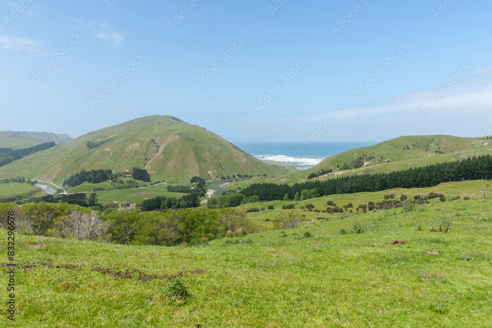 Stream through valley past fields and forestry to coastal Wairarapa. Stream through valley past fields and forestry to coastal Wairarapa.
