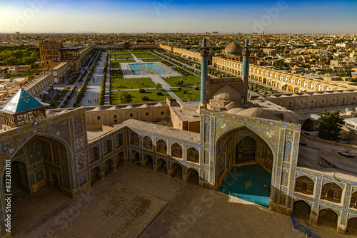 Iran. Isfahan. Naqsh-e Jahan Square (UNESCO World Heritage Site) and courtyard of the Shah Mosque, next: Ali Qapu Palace (left side square), Sheikh Lotfollah Mosque (right side)