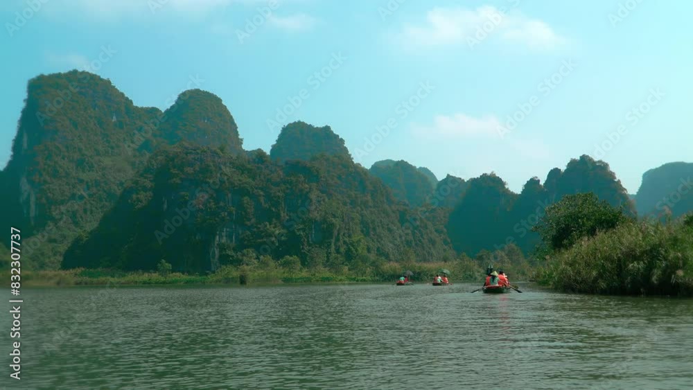 Breathtaking view of Tam Coc and Trang An, limestone mountains and river in Ninh Binh, Vietnam. Breathtaking view of Tam Coc and Trang An, limestone mountains and river in Ninh Binh, Vietnam.