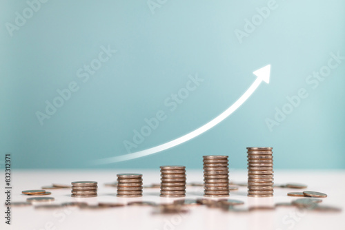 Invest,Investment,profit, saving money,finance and business strategy. Upward arrows with increasing piles of coins Indicating sales profit
