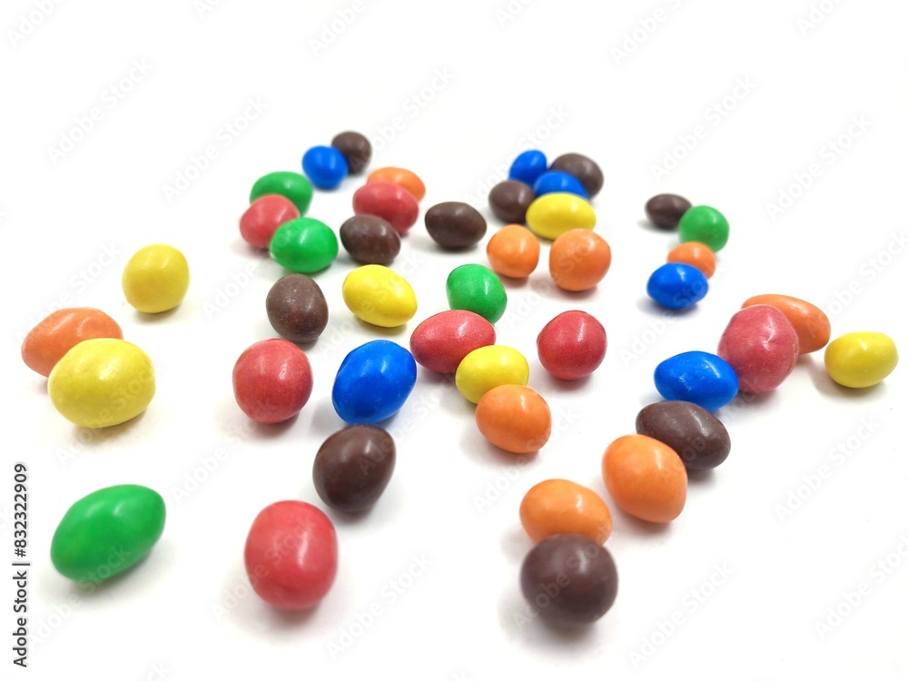 Photo of colorful chocolate buttons, isolated on white background. Photo of colorful chocolate buttons, isolated on white background.