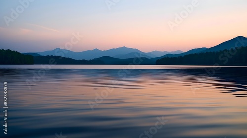 Tranquil Twilight Lake Reflections Enchant with Distant Mountains photo