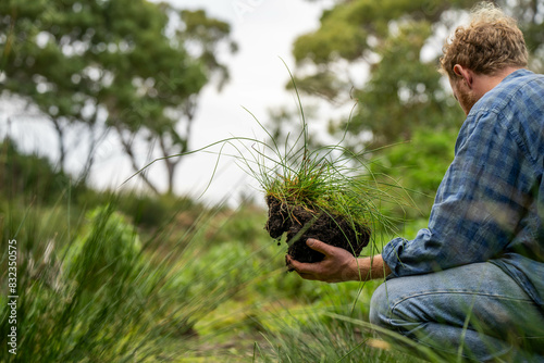 farmer hold soil in hands monitoring soil health on a farm.in australia photo