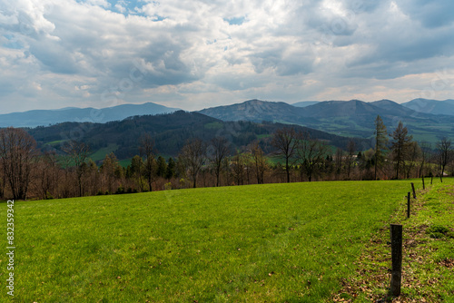 View to Ondrejnik mountain ridge and Moravskoslezske Beskydy mountains from hiking trail bellow Kubankov hill in Palkovicke hurky mountains in Czech republic photo