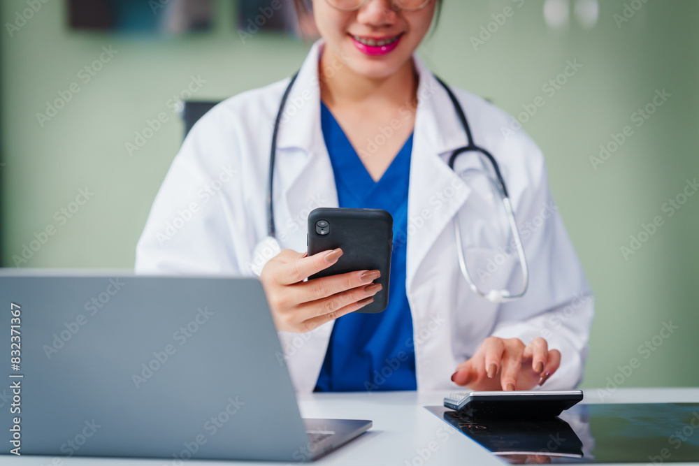 Asian female doctor specializes in psychiatry, providing online consultations and psychotherapy from her desk. She offers diagnosis, treatment, counseling, and medication for mental health disorders. Asian female doctor specializes in psychiatry, providing online consultations and psychotherapy from her desk. She offers diagnosis, treatment, counseling, and medication for mental health disorders.