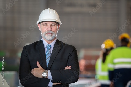 Εκτύπωση καμβά older owner engineer with beard mustache on face standing smile with his arms crossed at construction factory site