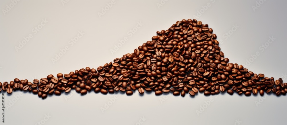 Studio shot of coffee beans shaped as an arrow. copy space available Studio shot of coffee beans shaped as an arrow. copy space available