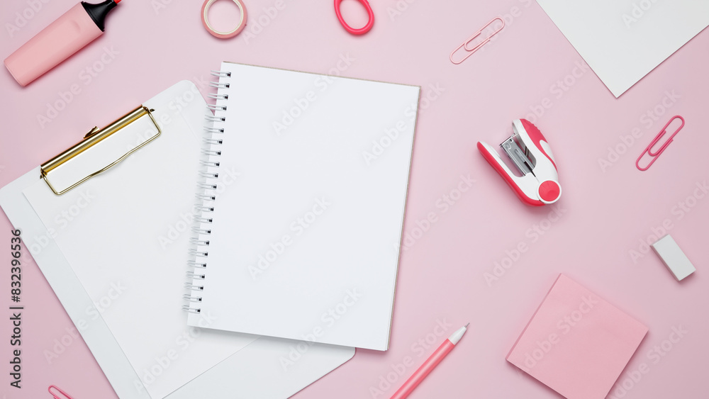 Creative flat lay mockup design of workspace. Top view composition with white notebook, to do list and stationery on pink background Creative flat lay mockup design of workspace. Top view composition with white notebook, to do list and stationery on pink background