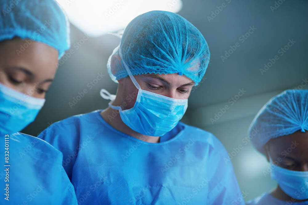 Team of doctors in surgery, healthcare and surgical procedure start with PPE and group in theatre in hospital. Medical operation, health insurance and safety gear with surgeon people in clinic Team of doctors in surgery, healthcare and surgical procedure start with PPE and group in theatre in hospital. Medical operation, health insurance and safety gear with surgeon people in clinic