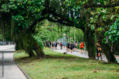 People stroll along the pedestrian path alongside Lagoa Rodrigo de Freitas, Rio de Janeiro, Brazil, South America photo