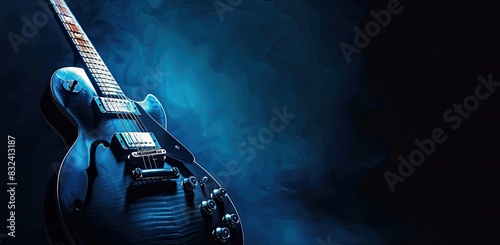 a image of a black electric guitar with a blue background