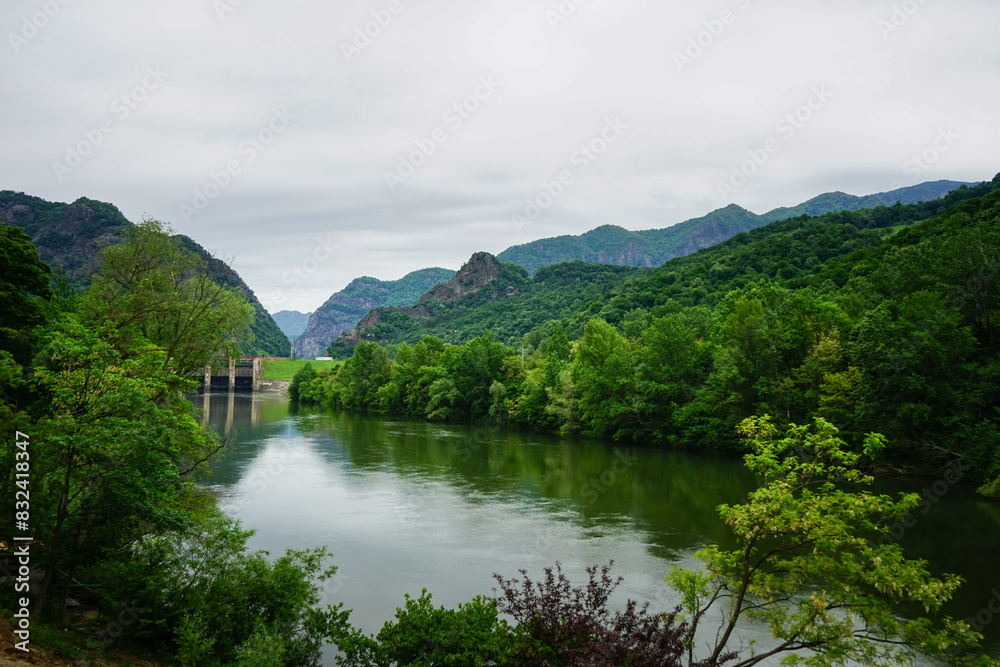 Fototapeta premium Olt river in a cloudy day, Transylvania, Romania