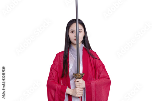 An oriental beauty in a red costume holds a sword
