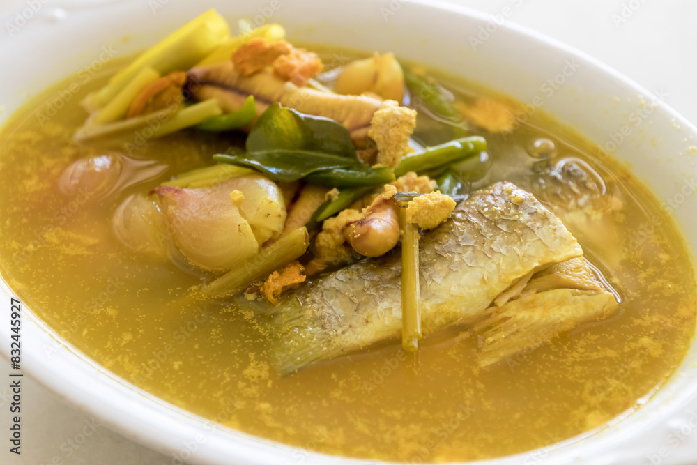 Turmeric fish soup (Pla Tom Kamin). A perfectly cooked fish fillet, simmered in a flavorful broth with a variety of vegetables and spices. Turmeric fish soup (Pla Tom Kamin). A perfectly cooked fish fillet, simmered in a flavorful broth with a variety of vegetables and spices.