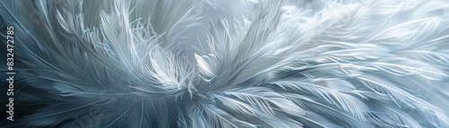 Abstract textured background with soft, swirling, light blue feathers.