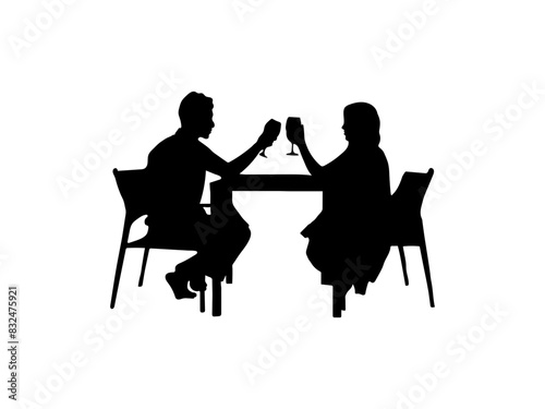 Couple having dinner silhouette.