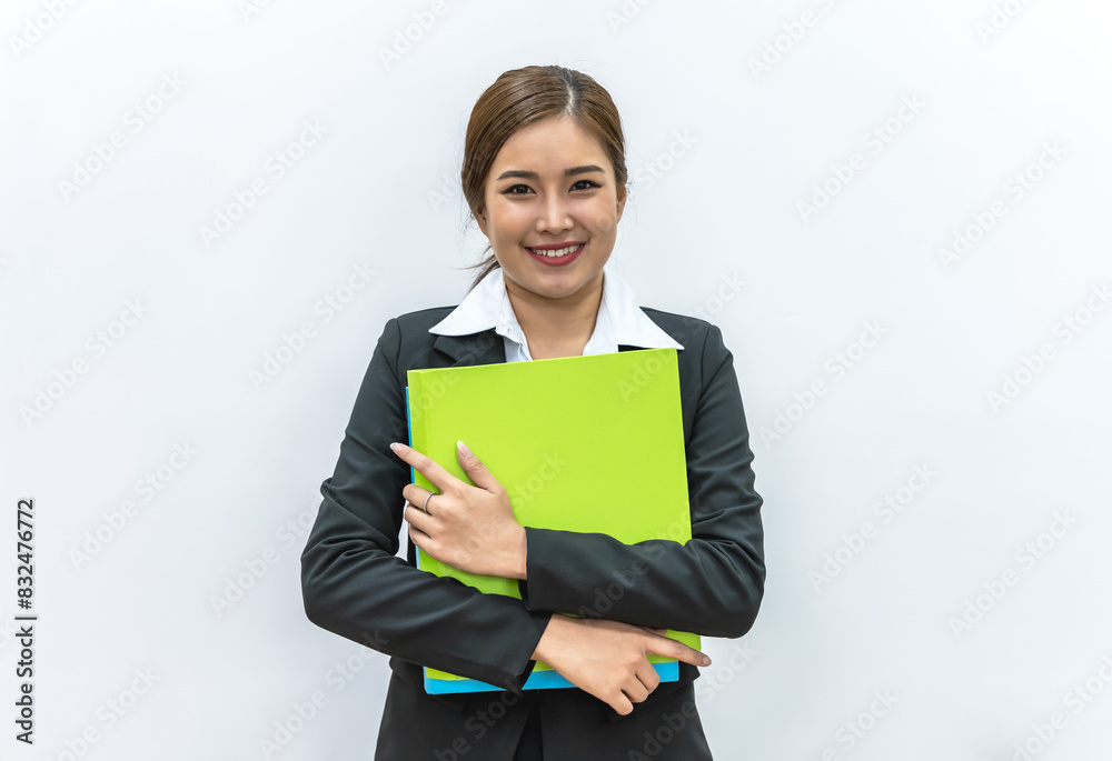 Smiling young Asian woman in casual black suit holding file on white background Smiling young Asian woman in casual black suit holding file on white background
