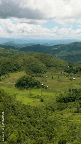 Aerial drone of conical hills with green vegetation in a mountainous area. Hinakpan Chocolate Hills. Negros, Philippines