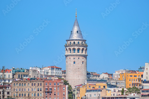 A closer look at the Galata Tower emphasises its medieval charm and architectural elegance with its solid stone walls and iconic conical roof.