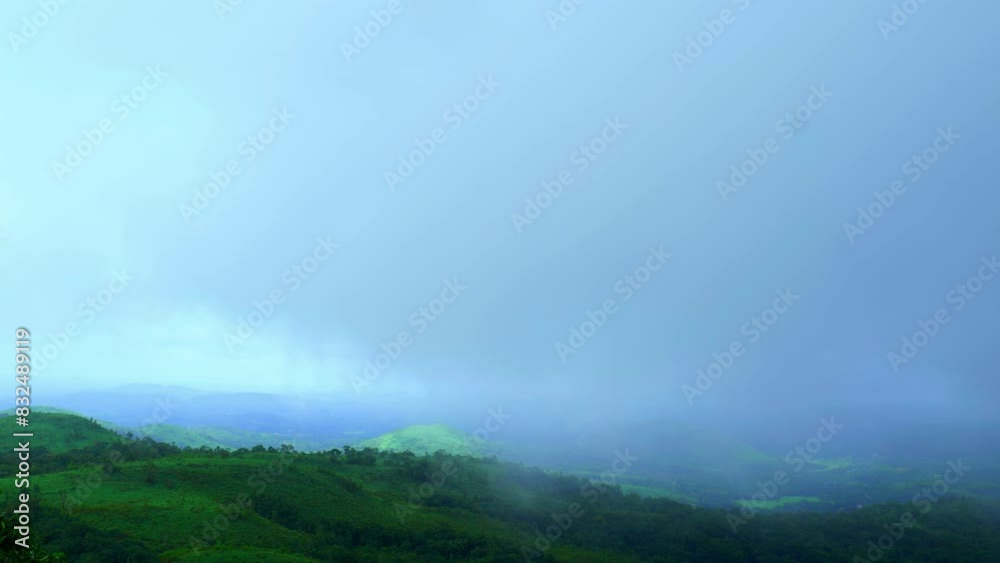Fog moving over the mountains in a forest. Fog moving over the mountains in a forest.