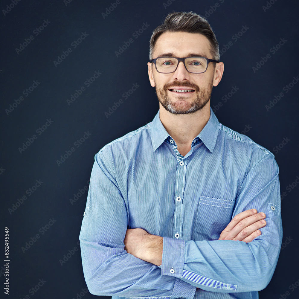 Portrait, businessman and mockup in dark studio with employee isolated on blue background with smile. Career, entrepreneur and about us in accounting company with glasses for confidence in firm. Portrait, businessman and mockup in dark studio with employee isolated on blue background with smile. Career, entrepreneur and about us in accounting company with glasses for confidence in firm.