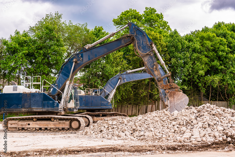 demolition comapany mechanical shovels on a job site with rubble remains of building shot in scarborough neighborhood of toronto demolition comapany mechanical shovels on a job site with rubble remains of building shot in scarborough neighborhood of toronto