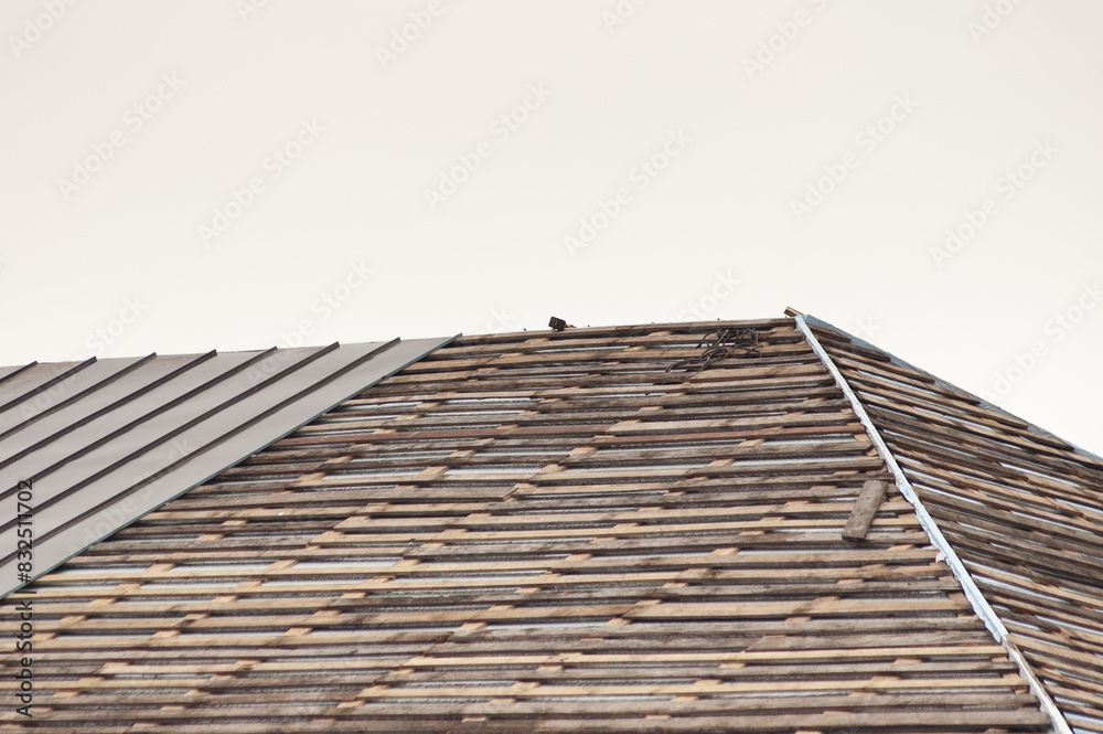 new roof of a building against a background of gray sky new roof of a building against a background of gray sky