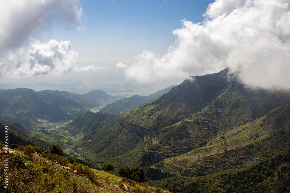 Fototapeta premium Amba Alaji in Ethiopia boasts a stunning landscape with majestic mountains, dramatic cliffs, and lush greenery, offering breathtaking vistas and a serene escape into nature's raw beauty. Peak at 3,420