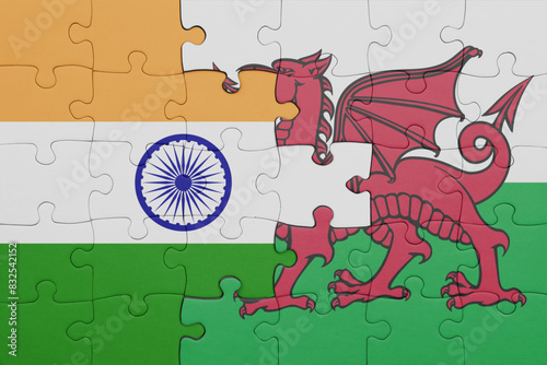 puzzle with the colourful national flag of wales and flag of india.