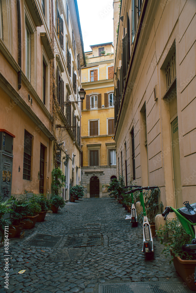 Obraz premium a street with old architecture and scooters